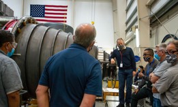 Aeroject Rocketdyne engineers and machinists inspect an engine nozzle. Aeroject Rocketdyne is building the engines for NASAs Space Launch System rocket, which will be used in the Moon mission.