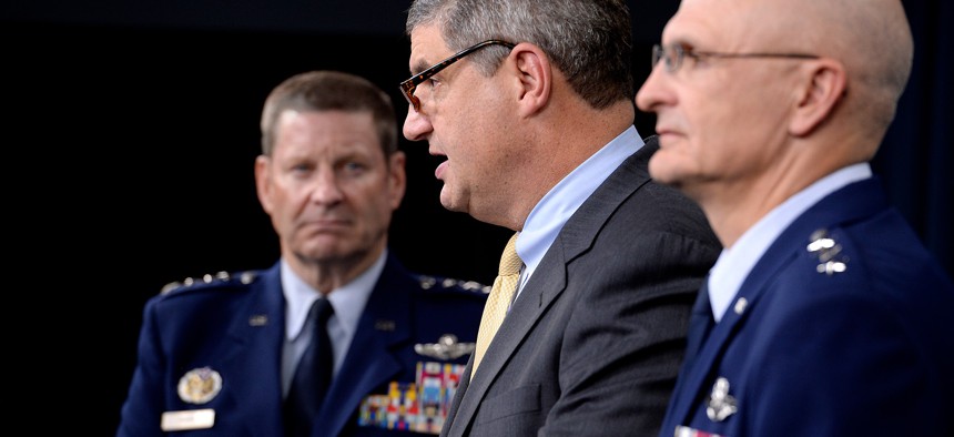 Dr. William LaPlante, then Assistant Secretary of the Air Force for Acquisition, takes questions at a 2015 press conference, flanked by Gen. Robin Rand (left) and Lt. Gen. Arnold Bunch Jr.