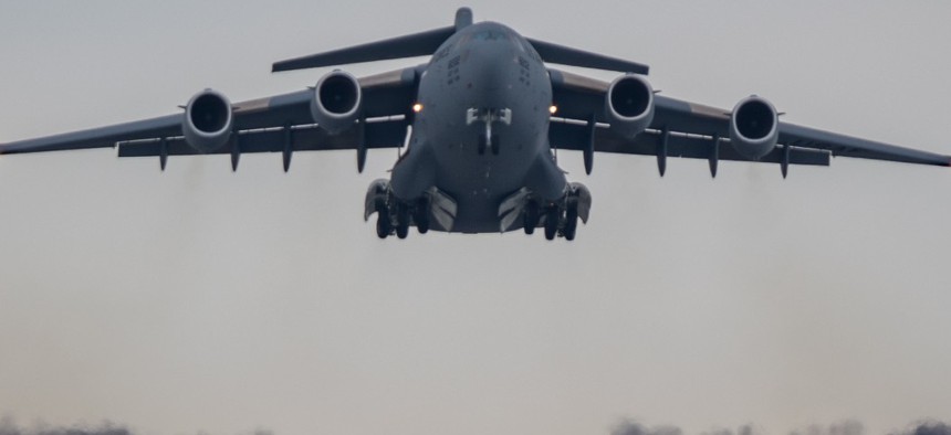 A C-17 Globemaster III assigned to Joint Base Lewis-McChord, Washington, takes off from a runway during Exercise Rainer War 22-A March 18.