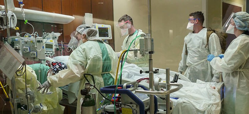 Trauma personnel treat a patient in the emergency department at Brooke Army Medical Center in San Antonio.