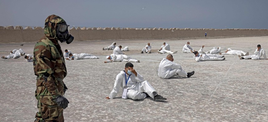 Members of the Moroccan Royal Armed Forces Rescue and Relief Unit take part in a biochemical simulation organized by the U.S. Defense Threat Reduction Agency as part of the "African Lion" military exercise in June 2021.