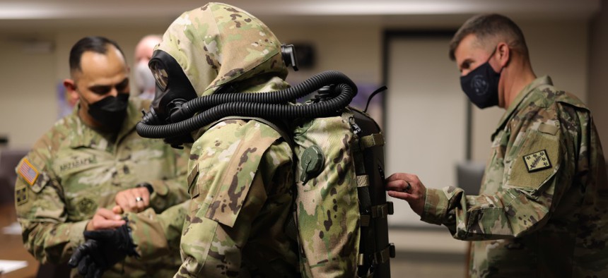 Army officials inspect the new personal protective equipment at Aberdeen Proving Ground, Maryland. 
