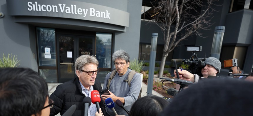 SANTA CLARA, CALIFORNIA - MARCH 13: Members of the media interview a Silicon Valley Bank customer outside of the bank office on March 13, 2023 in Santa Clara, California. Days after Silicon Valley Bank collapsed, customers are lining up to try and retrieve their funds from the failed bank. The Silicon Valley Bank failure is the second largest in U.S. history. (Photo by Justin Sullivan/Getty Images)