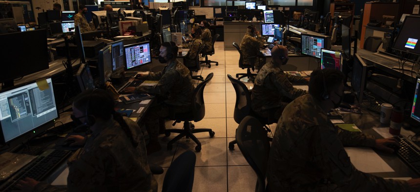 Hawaii and Oregon Air National Guard Airmen monitor pods of computer screens displaying the airspace above the Hawaiian islands during exercise Sentry Aloha 2021, Aug. 24, 2021.