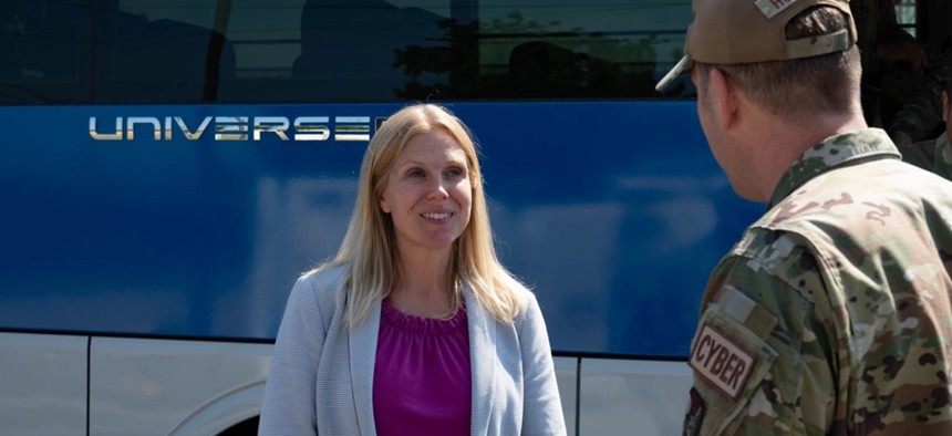 Then-Air Force Chief Information Officer Lauren Knausenberger greets 8th Communications Squadron leadership at Kunsan Air Base in South Korea on Sept. 27, 2022.