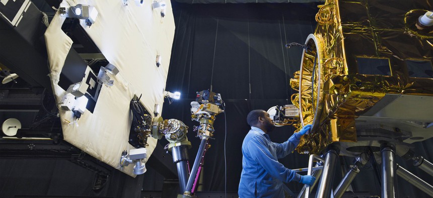 A techician tests satellite servicing technologies at Goddard Space Flight Center.