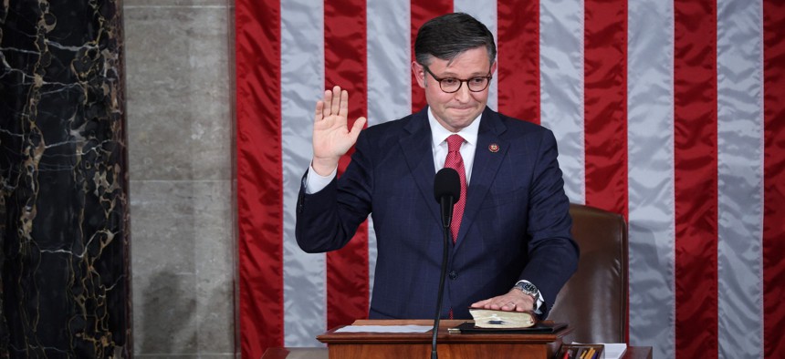 Newly elected House Speaker Mike Johnson takes his oath of office on October 25, 2023. Johnson was elected after a three-week vacancy.