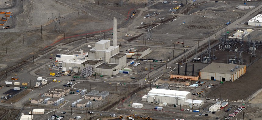 Workers demolish a decommissioned nuclear reactor at the Hanford site in March 2011.