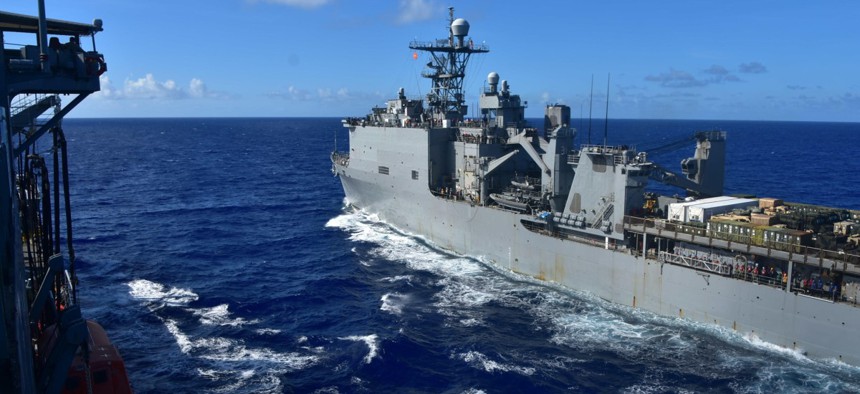 From left, the Henry J. Kaiser-class underway replenishment oiler USNS Tippecanoe (T-AO 199) prepares to resupply the Whidbey Island-class dock landing ship USS Rushmore (LSD 47) while operating in the Philippine Sea, Aug. 15, 2022