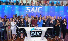 SAIC's executive team rings the closing bell on April 11 at the NASDAQ Marketsite in New York City.