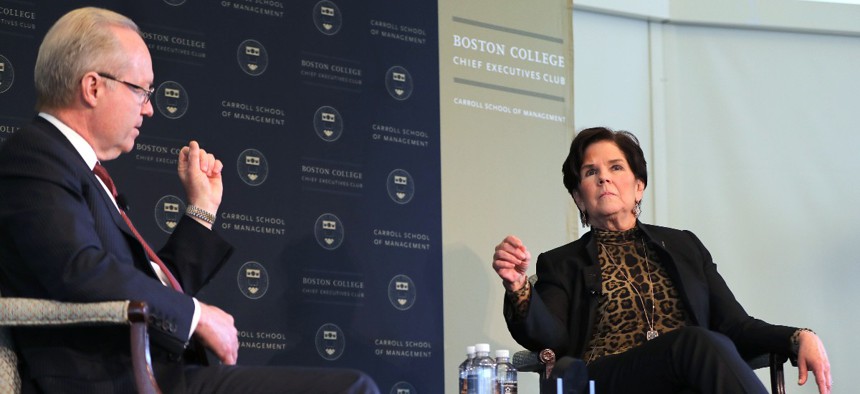 Then-Raytheon CEO Thomas Kennedy interviews General Dynamics CEO Phebe Novakovic during the Boston College Chief Executives Club luncheon on June 11, 2019 in Boston.