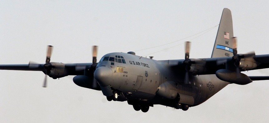 A U.S. Air Force C-130 Hercules lifts off for an airlift mission from a base in Southwest Asia.