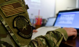 U. S. Air Force Capt. Kristina Linden, 355th Mental Health Clinic Social Worker, works on a task during Military Health System Genesis training at Davis-Monthan Air Force Base, Arizona, April 7, 2021. DOD is planning a sole source extension to migrate that system to the cloud before launching a sustainment contract.