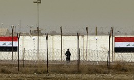 An Iraqi security officer patrols the grounds of the former Abu Ghraib prison, which is now known as the Baghdad Central Prison.