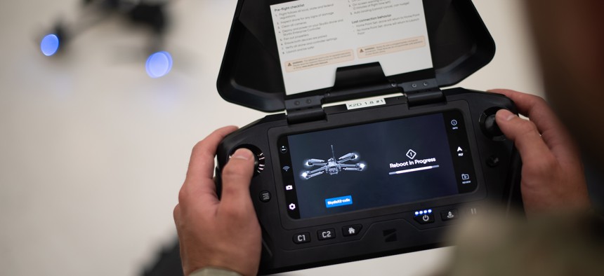 A U.S. Air Force member performs a system reboot before flying a Skydio X2D drone during a drone aircraft inspection program training at Travis Air Force Base, Calif., July 16, 2024.