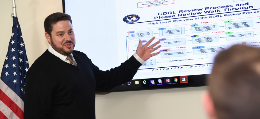In this 2018 photo, a contractor assigned to the Joint STARS Recapitalization program within the PEO Digital portfolio demonstrates a content sharing application at Hanscom Air Force Base, Mass.