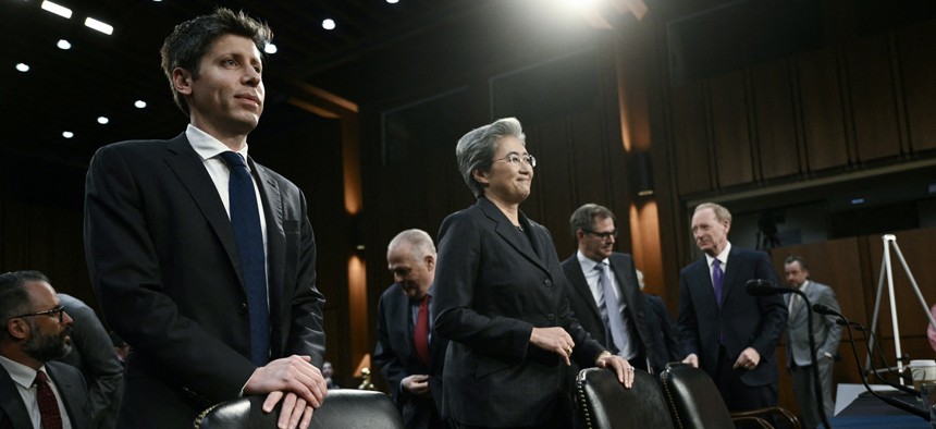 (L-R) Open AI CEO Sam Altman, Chairwoman and CEO of Advanced Micro Devices (AMD) Lisa Su, CoreWeave Co-Founder and Chief Executive Officer Michael Intrator and Microsoft Vice-Chair and President Brad Smith prepare to testify for a US Senate Commerce Committee hearing on artificial intelligence (AI) on Capitol Hill in Washington, DC, on May 8, 2025.