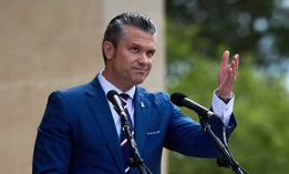 US Secretary of Defense Pete Hegseth gestures as he speaks during a ceremony at the Normandy American Cemetery to mark the 81st anniversary of the D-Day landings during World War II on June 06, 2025 in Colleville-sur-Mer, France