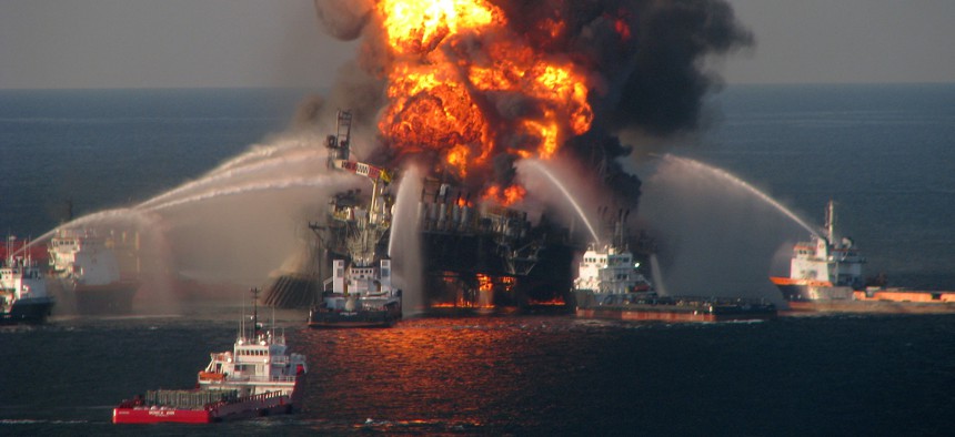 Coast Guard fire boats battle the blazing remnants of the off shore oil rig Deepwater Horizon in the Gulf of Mexico on April 21, 2010, near New Orleans.