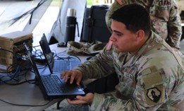An Army Reserve network communications systems specialist with 1st Mission Support Command tests a node at Antonio Rivera Rodríguez Airport in Vieques, Puerto Rico, on July 24, 2025.