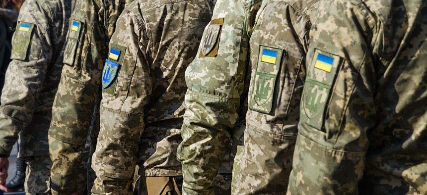 Ukrainian soldiers line up for a military parade.