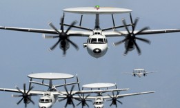A group of EC-2 Hawkeyes fly in formation.