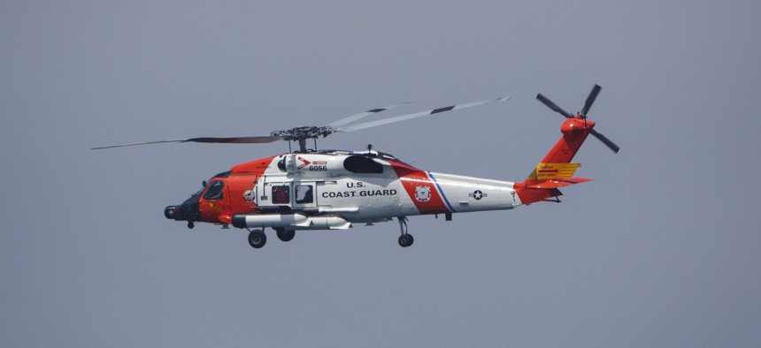 A U.S. Coast Guard Sikorsky MH-60T Jayhawk helicopter flies to the U.S. Coast Guard Sector San Diego air station on June 28, 2025 in San Diego.