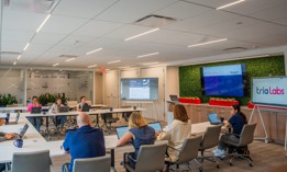 A meeting of Tria Labs team members.