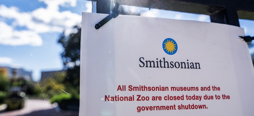 A sign outside the Smithsonian Castle on Oct. 20, 2025, informs visitors of closings due to the government shutdown. 