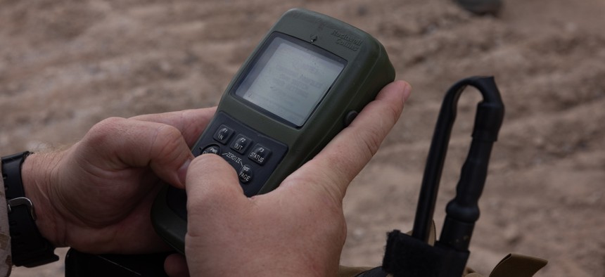 A Marine uses a defense advance GPS receiver during a close air support exercise in Yuma, Arizona, Sept. 27, 2025. 