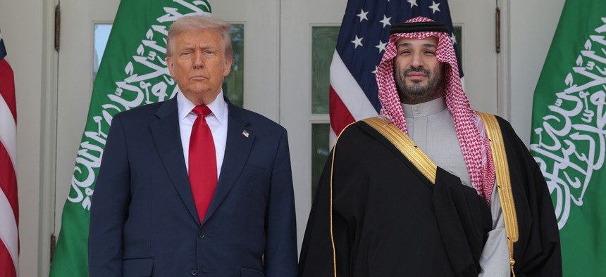 U.S. President Donald Trump (L) and Crown Prince and Prime Minister Mohammed bin Salman of Saudi Arabia pause for photographs along the West Wing Colonnade at the White House on November 18, 2025 in Washington, DC. 
