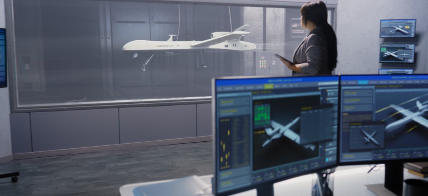 An engineer works on the prototype of a new drone design.