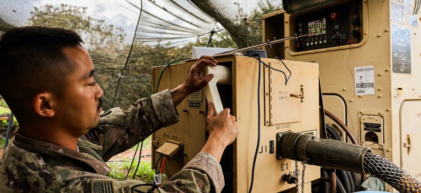 A soldier demonstrates an innovative tool his team manufactured during Joint Pacific Multinational Readiness Center 26-01 Nov. 4, 2025, Schofield Barracks, Hawaii. 