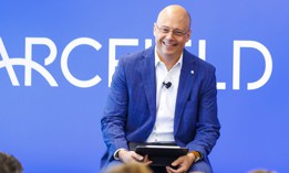 Arcfield's CEO Kevin Kelly addresses employees at a company town hall event.