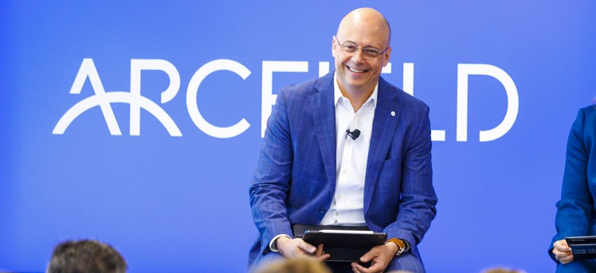 Arcfield's CEO Kevin Kelly addresses employees at a company town hall event.