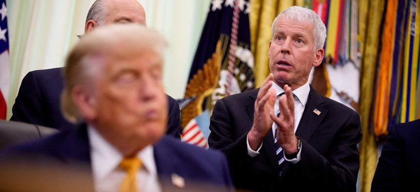 Energy Secretary Chris Wright (R), accompanied by U.S. President Donald Trump (L), speaks during an event in the Oval Office of the White House on June 22, 2026 in Washington, DC.