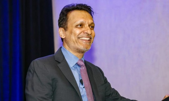 Digital Infuzion's founder and leader Hemant Virkar addressing employees.