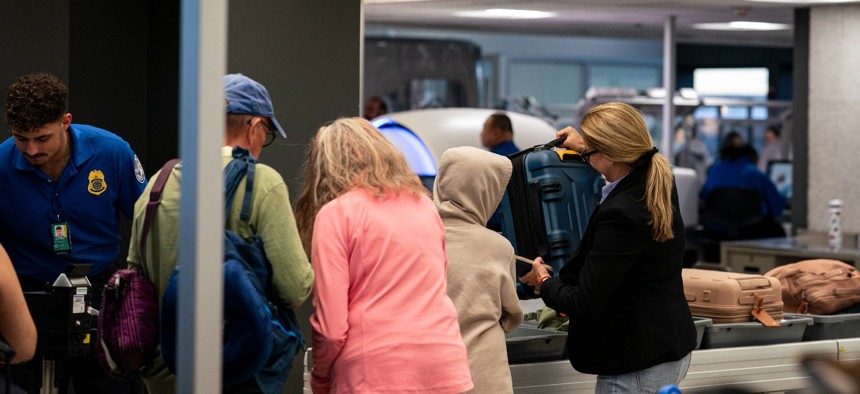 Passengers go through a Transportation Security Administration checkpoint at Washington Dulles International Airport (IAD) on Sept. 7.